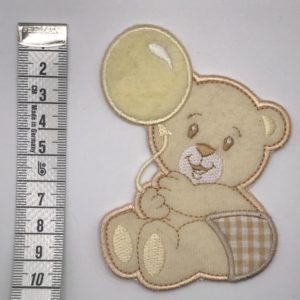 Heat adhesive motif for baby diapers and blankets